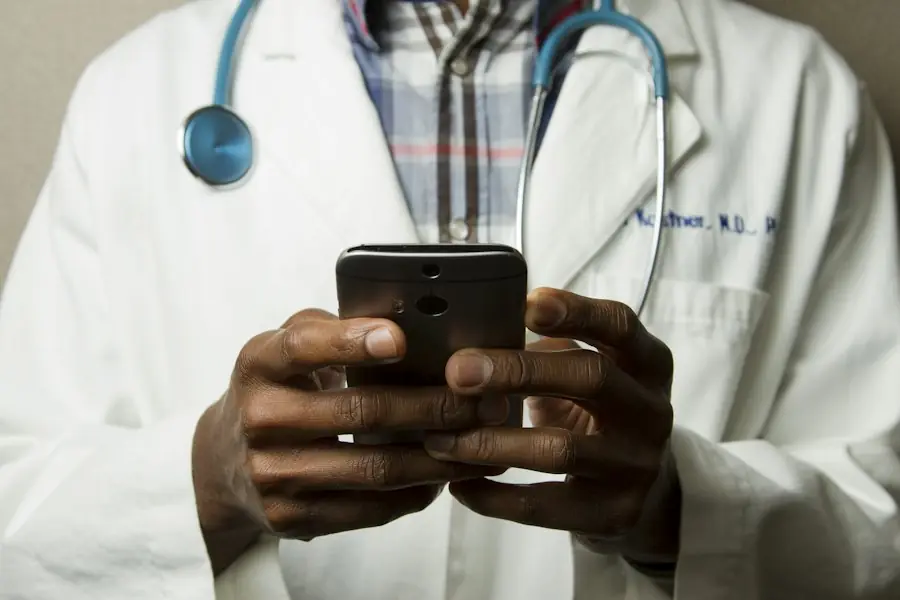 Doctor with a stethoscope using a smartphone