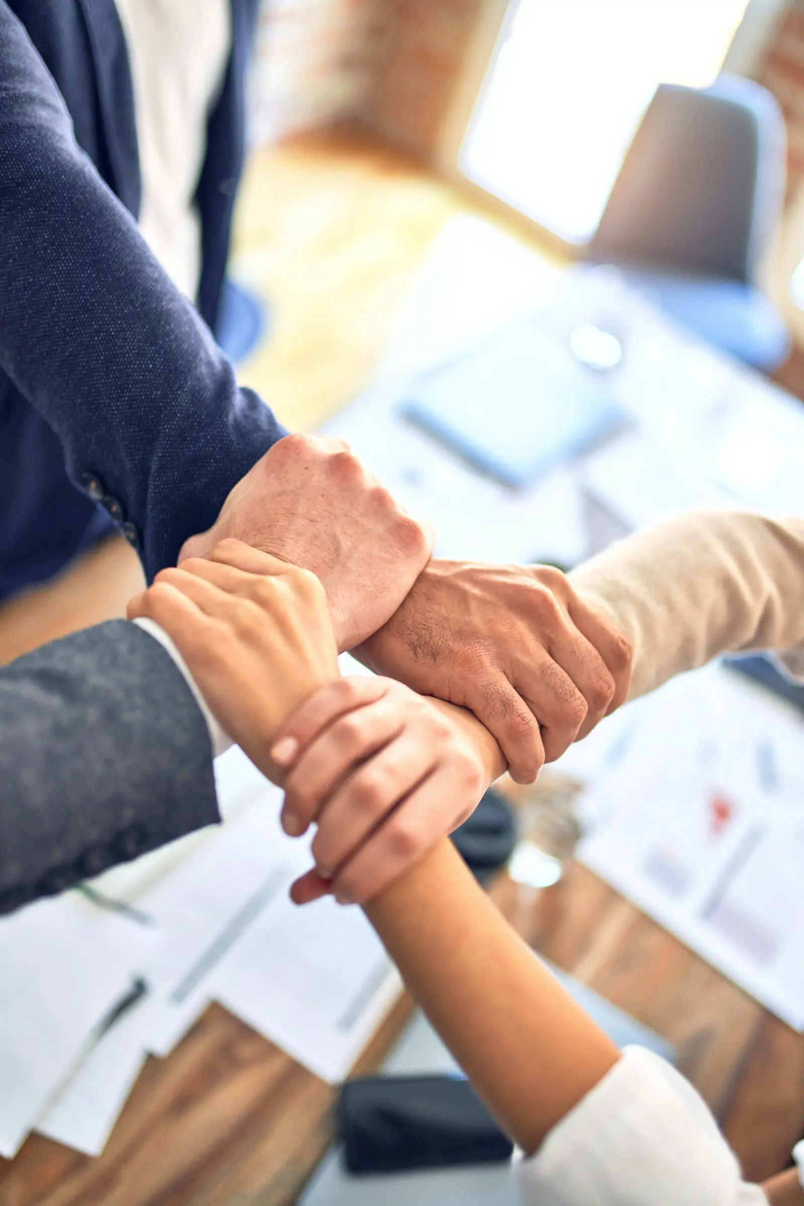 Hands joined together as a symbol of teamwork